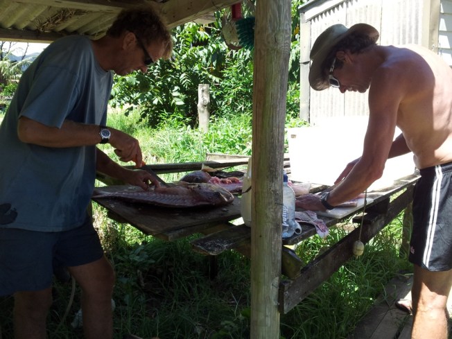 Two real Kiwi blokes preparing our seafood dinner.