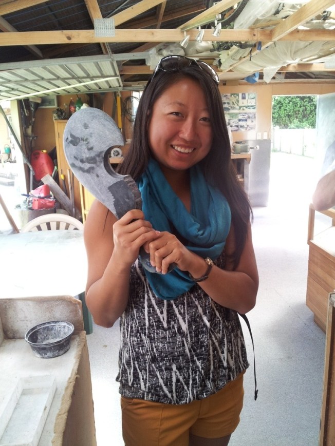 Holding a replica of the jade piece made for Obama