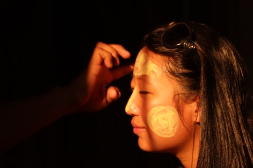 Krishna helped me put on Thanaka, a paste made from tree bark that Burmese people wear for beauty, keeping cool, and protection from the sun.